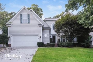 Indian Trail house for rent - a white house with a lawn and a driveway