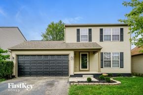 Galloway house for rent - A house with a garage door and a sign that says "FirstKey Homes".