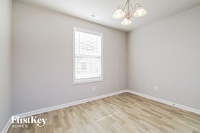 Benson house for rent - the living room of a new home with wood flooring and a window