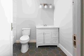 Long Beach apartment for rent - a white bathroom with a toilet and a sink