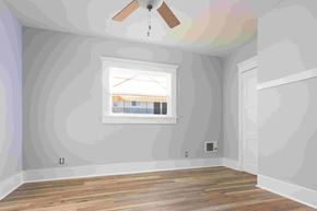 Long Beach apartment for rent - an empty room with a window and a ceiling fan