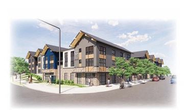 Spokane apartment for rent - A street view of a modern building with a blue and brown facade.