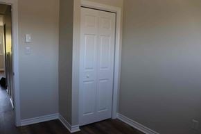 Wolfville apartment for rent - a closet with a white door and a door to a hallway