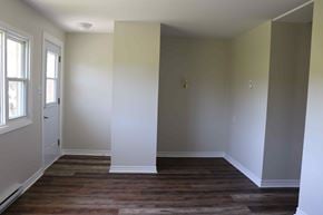 Wolfville apartment for rent - a empty room with white walls and a wood floor