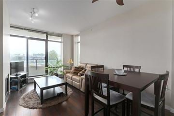 Burnaby apartment for rent - A living room with a brown table and chairs.