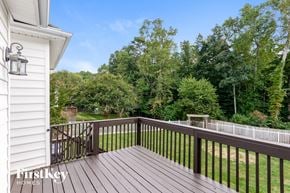 Stanley house for rent - a deck with a view of a yard and trees