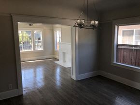Los Angeles apartment for rent - an empty living room with wood floors and a fireplace