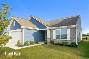 Whitestown house for rent - A house with a blue garage door is for sale by FirstKey Homes.