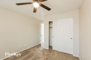 Glendale house for rent - a bedroom with a ceiling fan and a closet