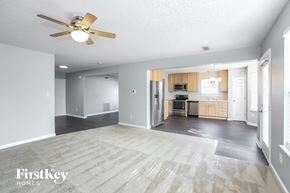 Westfield house for rent - an empty living room and kitchen with a ceiling fan
