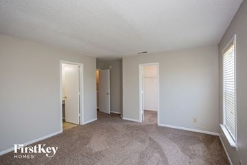 Fishers house for rent - a spacious living room with white walls and carpet