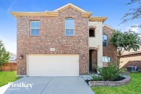 Fort Worth house for rent - a brick house with a white garage door