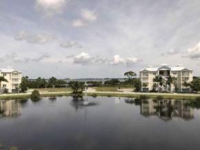 Bradenton house for rent - a view of a lake with apartments in the background