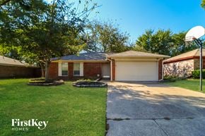 Arlington house for rent - a small brick house with a basketball hoop on the driveway