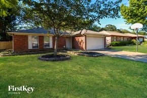 Arlington house for rent - a small brick house with a tree in the front