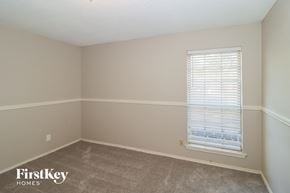 Arlington house for rent - a bedroom with a window and a carpeted floor