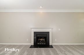 Clemmons house for rent - A fireplace in a room with a carpeted floor.