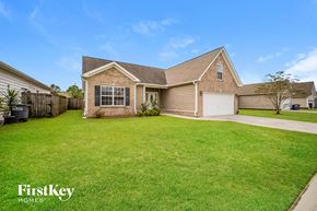 North Charleston house for rent - A house with a garage and a driveway is for sale.
