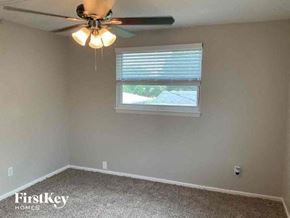 Largo house for rent - an empty room with a ceiling fan and a window