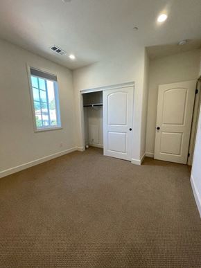Santa Barbara apartment for rent - A room with a carpeted floor and a window.