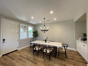 Santa Barbara apartment for rent - A dining room with a white table and chairs.