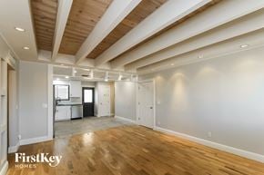 Phoenix house for rent - a living room with white walls and a wooden floor