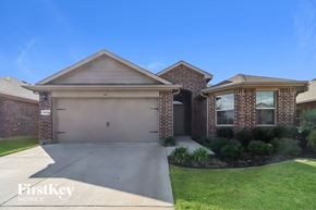 Fort Worth house for rent - a home with a driveway and a garage door