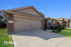 Fort Worth house for rent - an empty driveway in front of a house