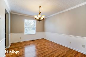 Hilliard house for rent - the living room of a home with wood floors and a chandelier