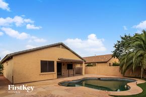 Glendale house for rent - A house with a pool in the backyard.