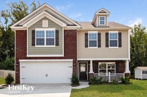 Lexington house for rent - A two-story house with a garage and a small porch.