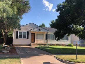 Snyder house for rent - a white house with a yard and trees