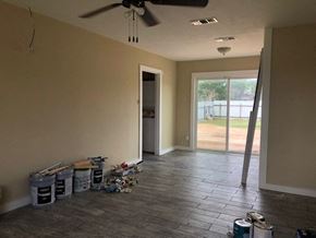 Snyder house for rent - A room with a ceiling fan and a door leading to a balcony.