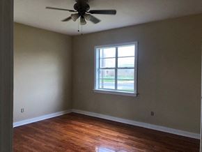 Snyder house for rent - A room with a ceiling fan and a window.