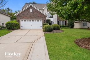 Huntersville house for rent - a white garage door in front of a house