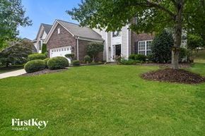 Huntersville house for rent - a home with a lawn and a tree in front of it