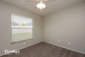 Kissimmee house for rent - the second bedroom has a large window and a ceiling fan