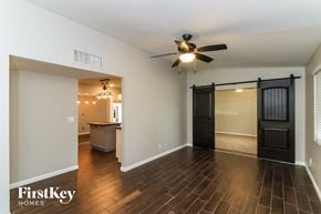 Mesa house for rent - the living room and dining room with a sliding barn door