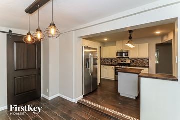Mesa house for rent - a kitchen with a counter top and a refrigerator