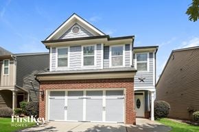 Lawrenceville house for rent - a white garage door in front of a house