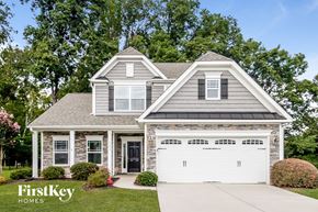 High Pt house for rent - a home with a white garage door in front of a house