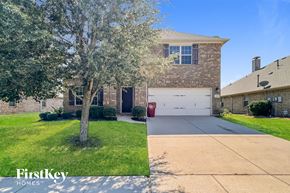Royse City house for rent - A house with a tree in front of it.