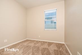 Riverview house for rent - a spacious room with carpet and a window