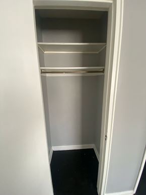 Cincinnati apartment for rent - A white open cupboard with three shelves.