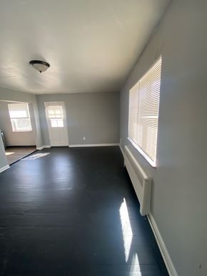 Cincinnati apartment for rent - A room with a black floor and white walls.