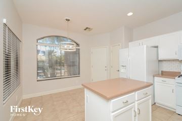 El Mirage house for rent - A kitchen with a white counter and cabinets.
