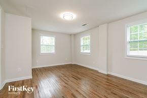 Covington house for rent - the spacious living room with wood floors and white walls