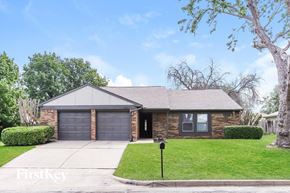 Fort Worth house for rent - A house with a garage and a mailbox in front.