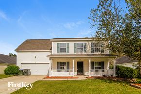Summerville house for rent - A two-story house with a front porch and a garage.