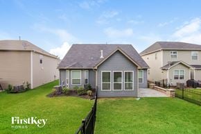 Mooresville house for rent - a small house with a yard and a grassy yard